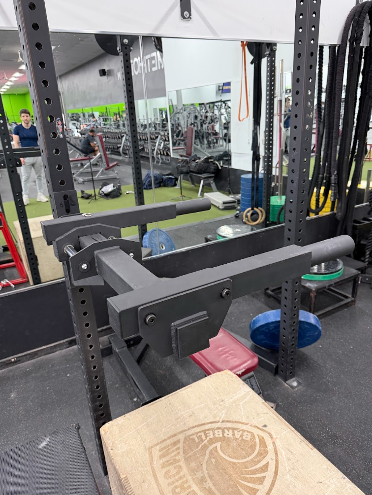 Rack-mounted Street Spec Dip Bar installed for weighted dip training