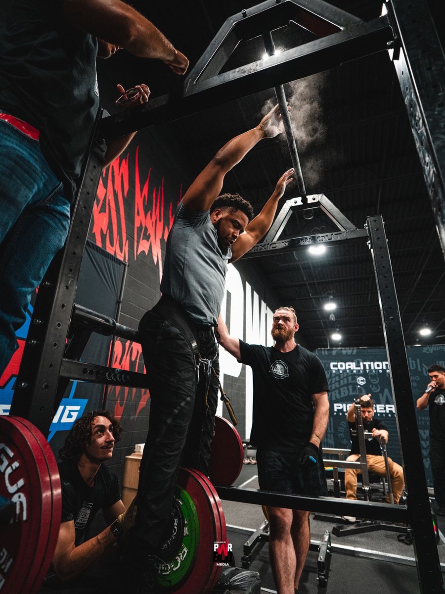 Streetlifting athlete warming up before competition attempts